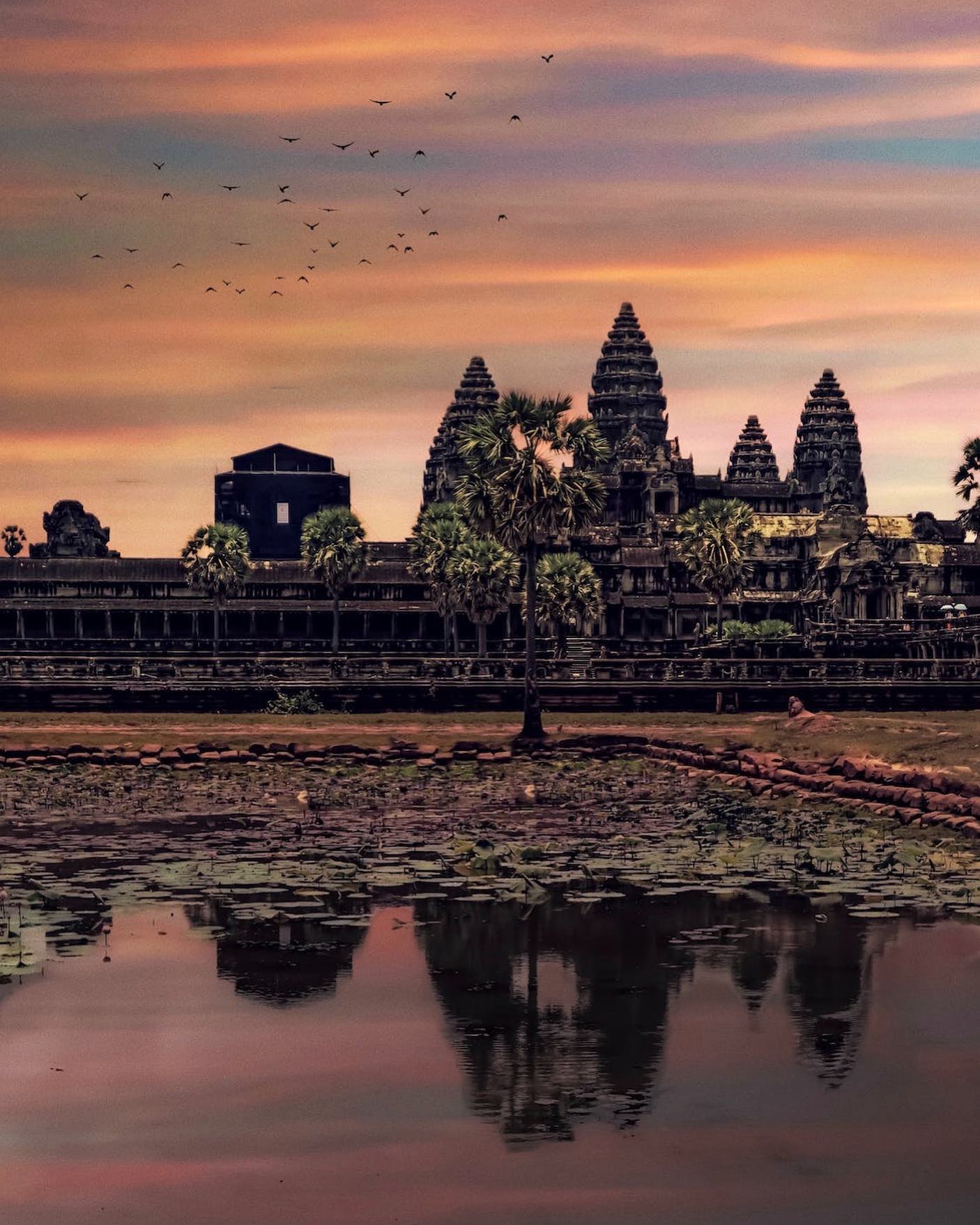 View of Angkor Wat in Cambodia during Sunset by Daniel Lazarov