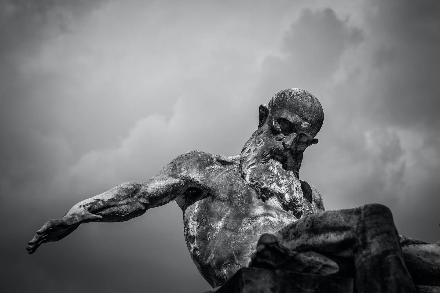 Grayscale Photo of Gray Man Statue by Francesco Ungaro